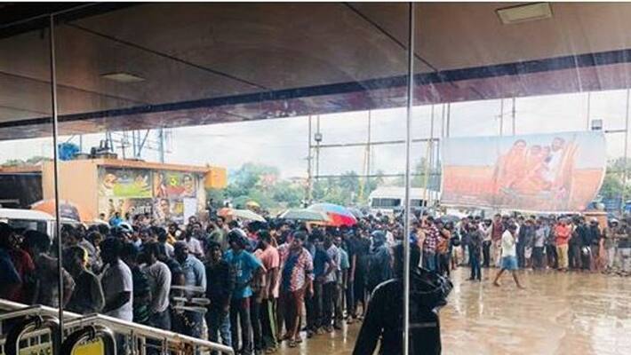 vijay fans stand in long queue and trying to get the tickets for the film bigil vijay fans stand in long queue and trying to get the tickets for the film bigil