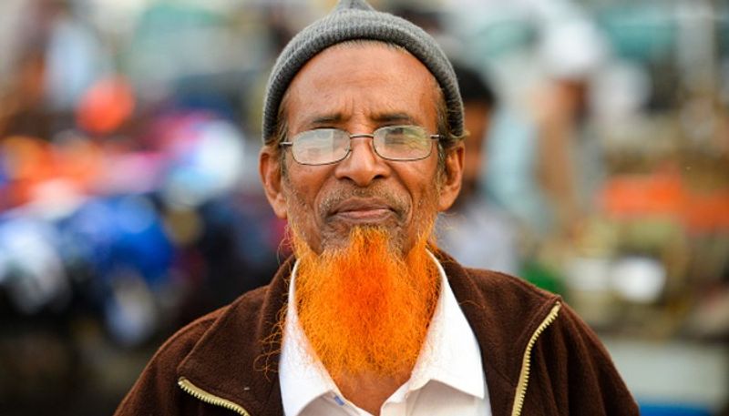 reason why bangladeshi men are dyeing their beards orange