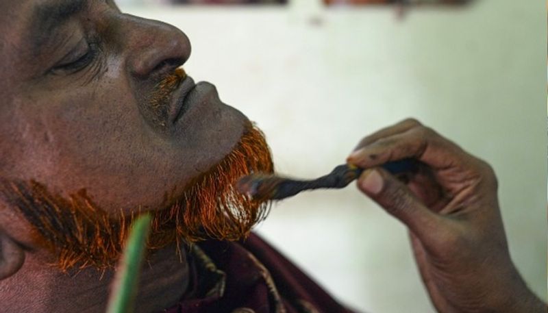 reason why bangladeshi men are dyeing their beards orange
