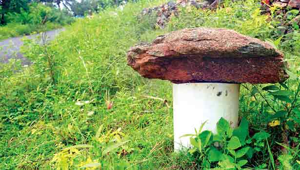 public closed bore well with big stone