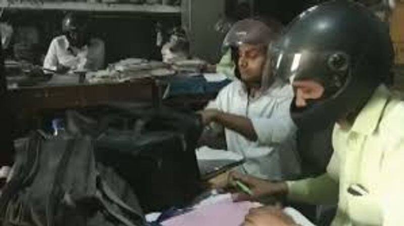 Employees Of a UP Government Office Are Wearing Helmets To Work