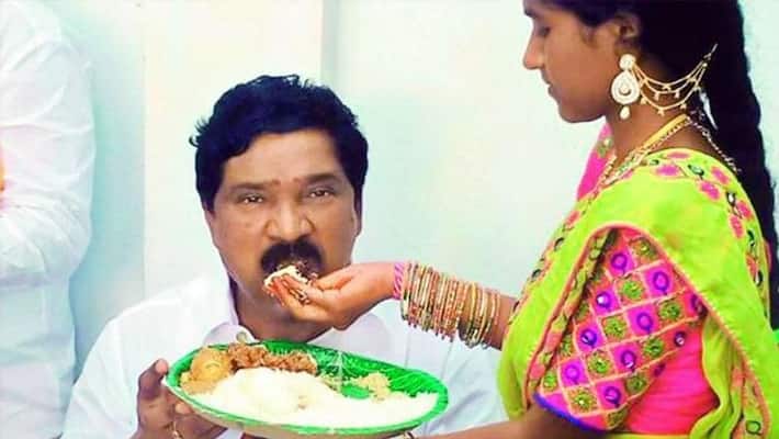 Girl feeds TRS MLA Thatikonda Rajaiah, video goes viral in Social media Girl feeds TRS MLA Thatikonda Rajaiah, video goes viral in Social media