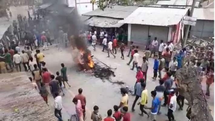 Tension in Raiganj as angry mob protested against hooliganism of a TMC leader Tension in Raiganj as angry mob protested against hooliganism of a TMC leader