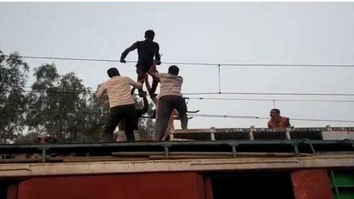 This young man climb on the railway wire, brought the engine to take down This young man climb on the railway wire, brought the engine to take down
