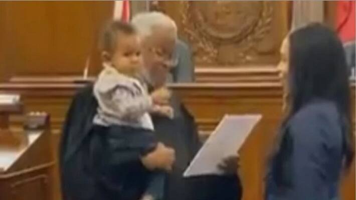 Judge Holds Baby While His Mom Takes Oath To Become Lawyer Judge Holds Baby While His Mom Takes Oath To Become Lawyer