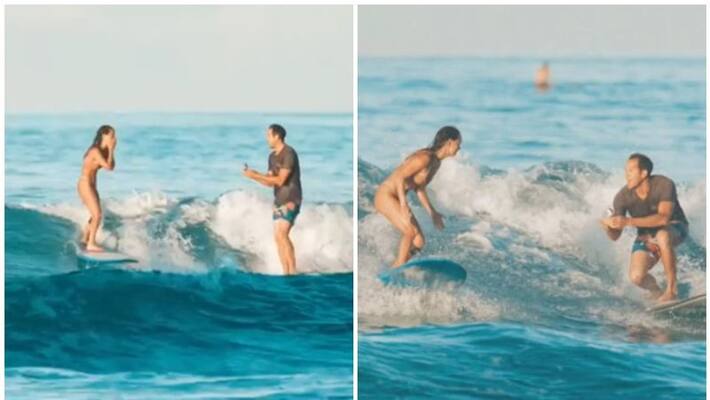 Man proposes girlfriend while surfing Man proposes girlfriend while surfing