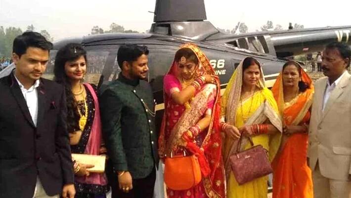 bride groom arrives in village from helicopter bride groom arrives in village from helicopter