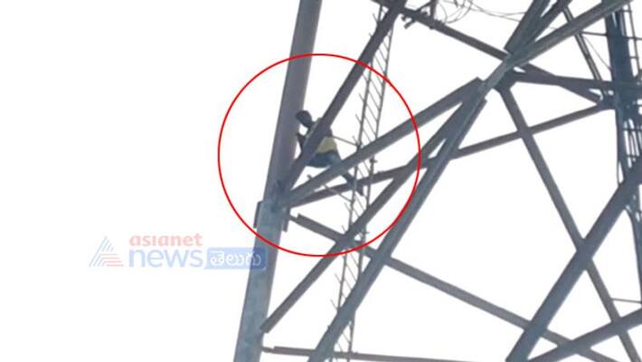 young man climbs cell tower and halchal at jangareddygudem - bsb young man climbs cell tower and halchal at jangareddygudem - bsb