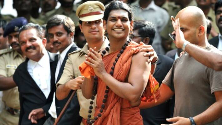 Police officers shouting at the Nithyananda Ashram Police officers shouting at the Nithyananda Ashram