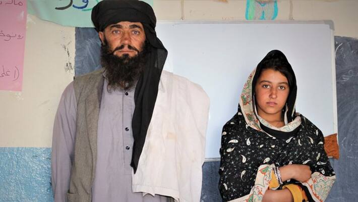 This father travels 12 kilometers daily to teach daughters This father travels 12 kilometers daily to teach daughters