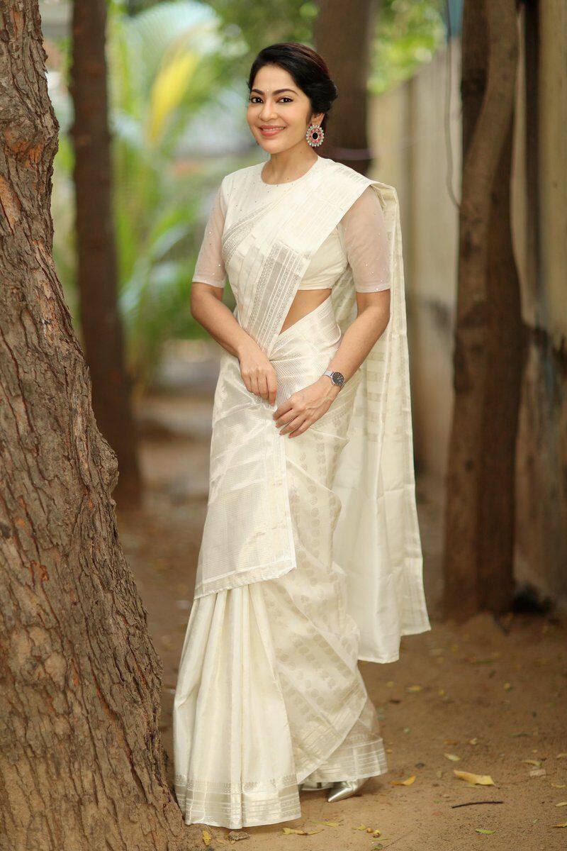 VJ Ramya in white sari