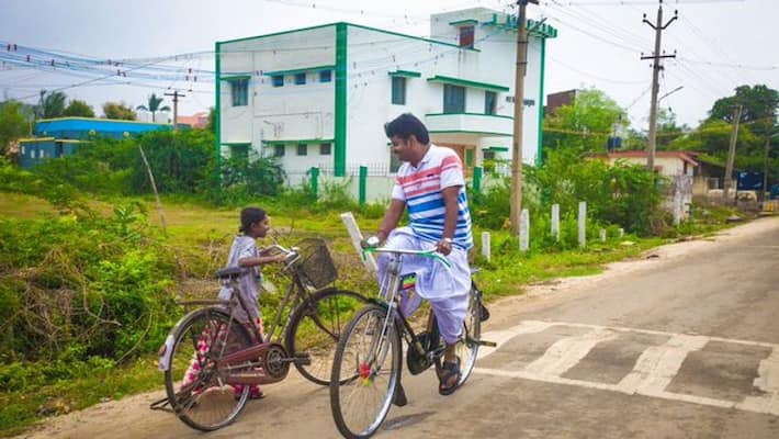 tamil nadu health minister vijayabashkar traveling in bicycle in his home town tamil nadu health minister vijayabashkar traveling in bicycle in his home town