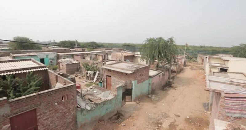 Pakistani Mohallas sans power or water right  next to the plush farm houses in Delhi