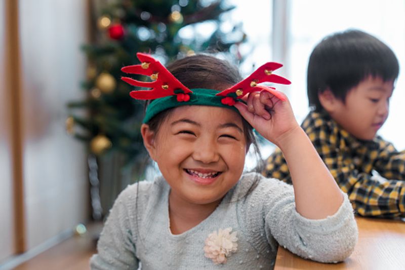 Young girls love Christmas reindeer antlers