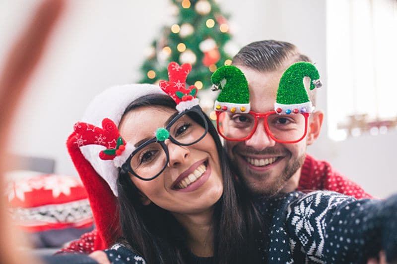 Selfies with the Christmas tree in the background captures the perfect bond