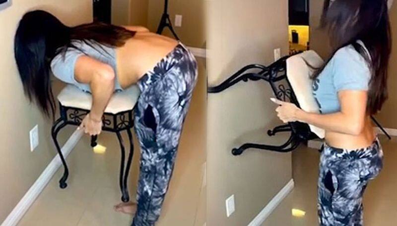 Chair challenge' has couples in hysterics as women easily complete the task - but men can't do it