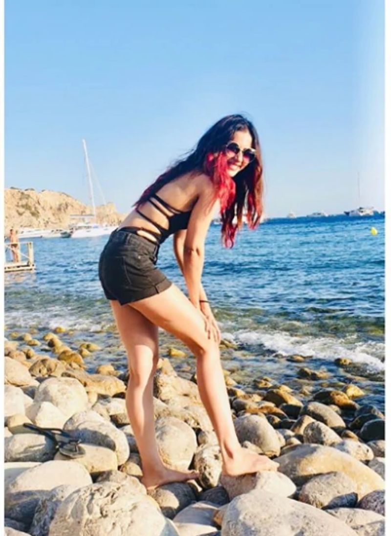 In the pictures, Rakul is showing her perfect bod in a blue bikini on the seashore of Ibiza.