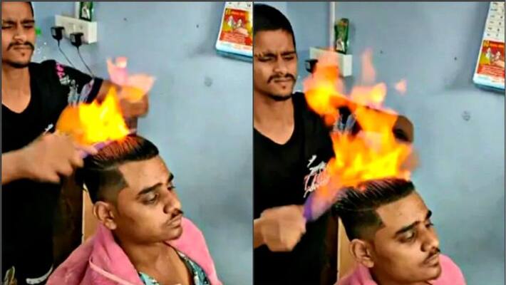Video of a barber cutting hair with fire goes viral Video of a barber cutting hair with fire goes viral