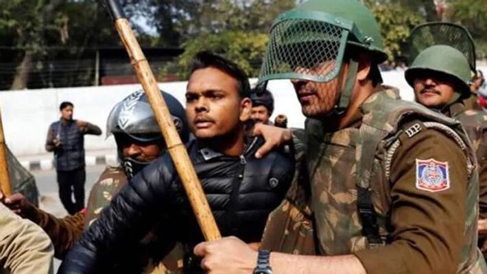 man fires at student protesters of jamia milia man fires at student protesters of jamia milia