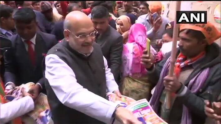 union Home Minister Amit Shah during 'Jansampark Abhiyan' in Delhi kps union Home Minister Amit Shah during 'Jansampark Abhiyan' in Delhi kps