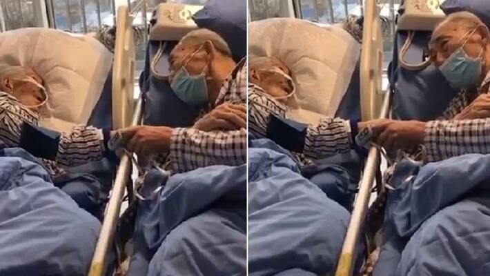 Old couple above 80 years infected with corona virus hold hands in icu for last time kph Old couple above 80 years infected with corona virus hold hands in icu for last time kph
