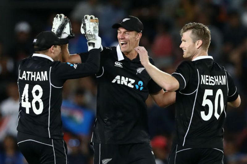 Tom Latham, Kyle Jamieson and Jimmy Neesham of the Black Caps celebrate after winning game two of the One Day International Series between New Zealand and India at at Eden Park on February 08, 2020 in Auckland, New Zealand.