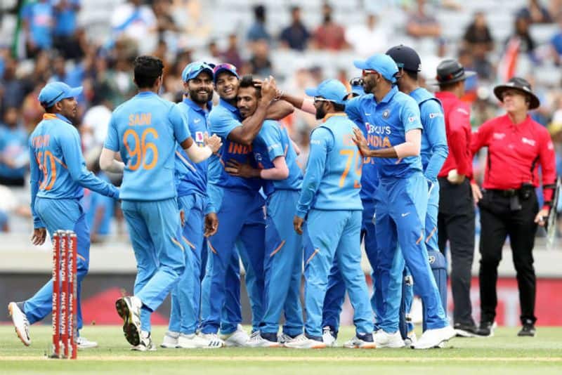Yuzvendra Chahal of India celebrates the wicket of Mark Chapman of the Black Caps with Virat Kohli and his team during game two of the One Day International Series between New Zealand and India at at Eden Park on February 08, 2020 in Auckland, New Zealand.