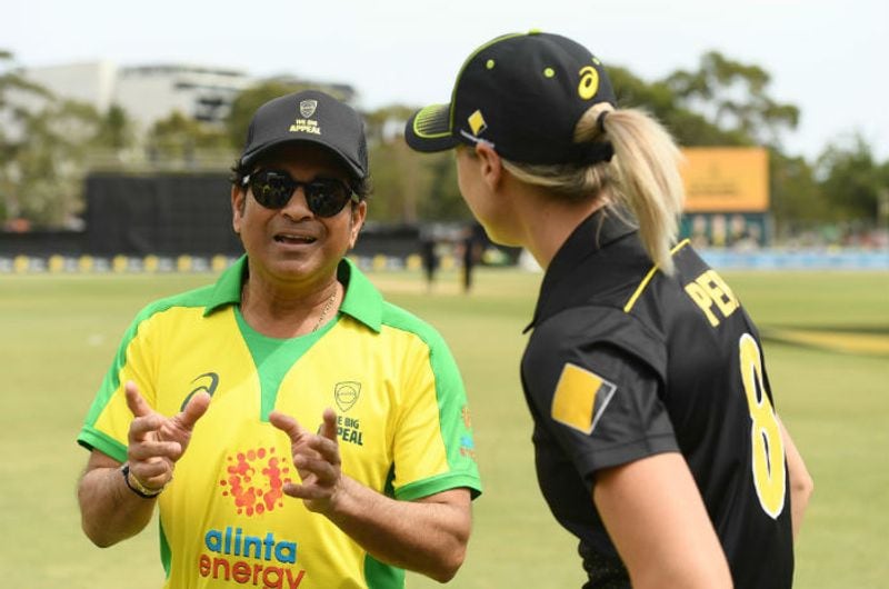 Sachin Tendulkar speaks to Ellyse Perry during the Bushfire Cricket Bash T20 match between the Ponting XI and the Gilchrist XI at Junction Oval on February 09, 2020 in Melbourne, Australia. Sachin Tendulkar accepted a challenge thrown by superstar Australia women's team all-rounder Ellyse Perry to come out of retirement and play one over during innings break.