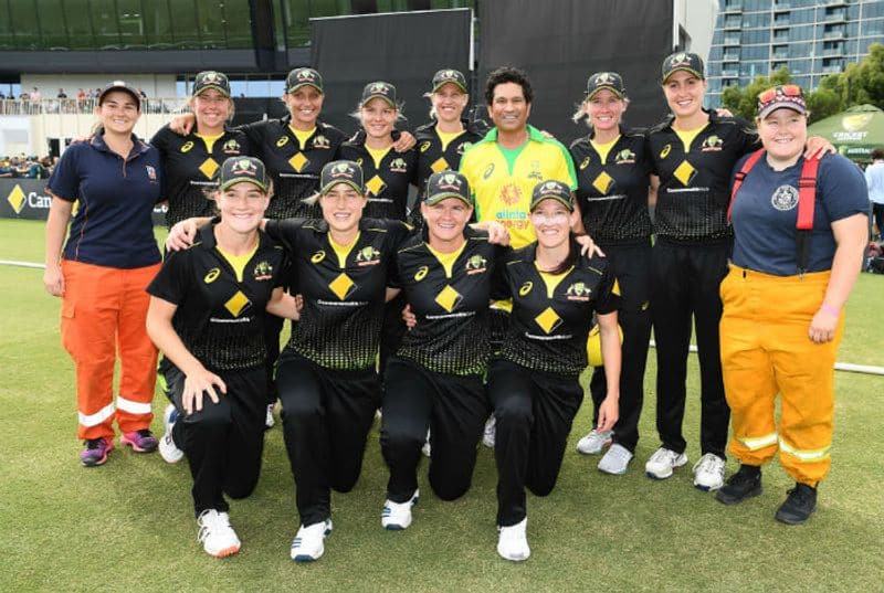 Sachin Tendulkar poses with the Australian Women's Cricket team during the Bushfire Cricket Bash T20 match between the Ponting XI and the Gilchrist XI at Junction Oval on February 09, 2020 in Melbourne, Australia.
