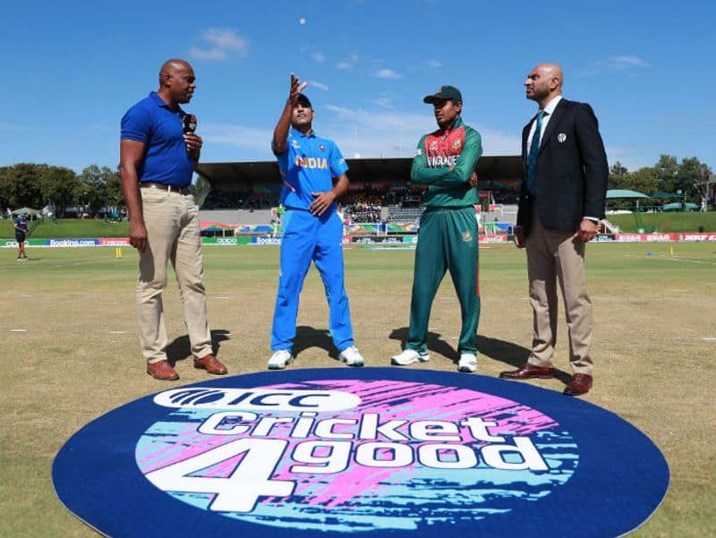 Priyam Garg of India and Mohammad Akbar Ali of Bangladesh pictured during the coin toss ahead of the ICC U19 Cricket World Cup Super League Final match between India and Bangladesh at JB Marks Oval on February 09, 2020 in Potchefstroom, South Africa. (Photo by Matthew Lewis-ICCICC via Getty Images)