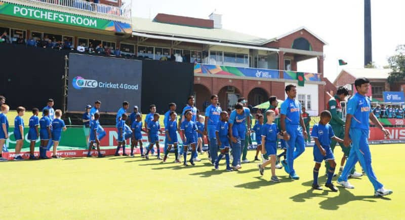 India walk with Bangladesh ahead of the ICC U19 Cricket World Cup Super League Final match between India and Bangladesh at JB Marks Oval on February 09, 2020 in Potchefstroom, South Africa. (Photo by Matthew Lewis-ICCICC via Getty Images)