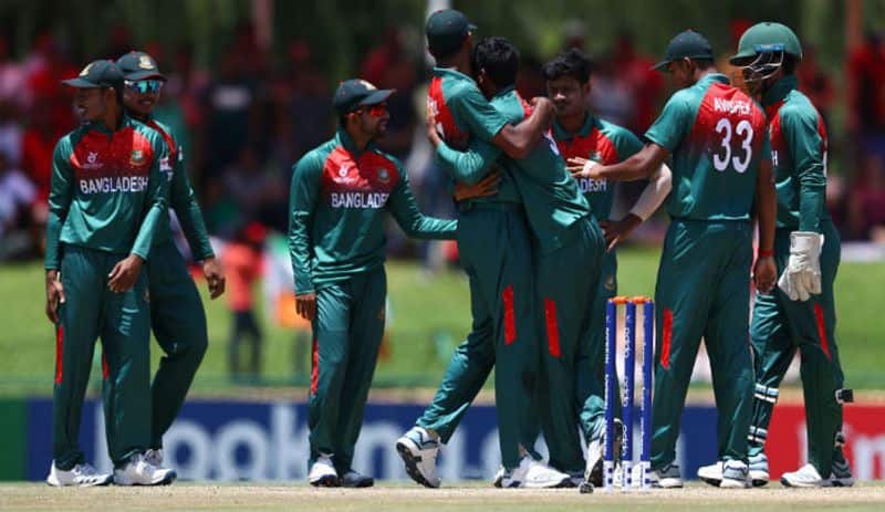 Mohammad Shoriful Islam of Bangladesh congratulates Rakibul Hasan of Bangladesh on the wicket of Priyam Garg of India during the ICC U19 Cricket World Cup Super League Final match between India and Bangladesh at JB Marks Oval on February 09, 2020 in Potchefstroom, South Africa. (Photo by Matthew Lewis-ICCICC via Getty Images)