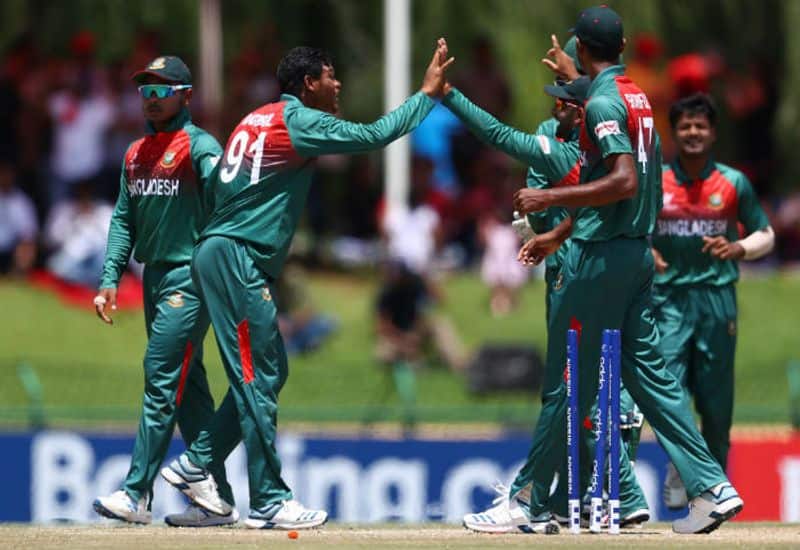 Rakibul Hasan of Bangladesh is congratulated on the wicket of Dhruv Jurel of India during the ICC U19 Cricket World Cup Super League Final match between India and Bangladesh at JB Marks Oval on February 09, 2020 in Potchefstroom, South Africa. (Photo by Matthew Lewis-ICCICC via Getty Images)