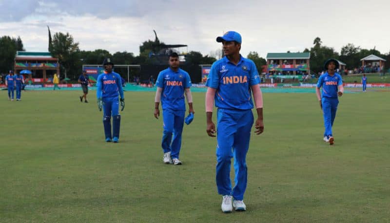 Priyam Garg of India leads his team off the field, as rain stops play during the ICC U19 Cricket World Cup Super League Final match between India and Bangladesh at JB Marks Oval on February 09, 2020 in Potchefstroom, South Africa. (Photo by Matthew Lewis-ICCICC via Getty Images)