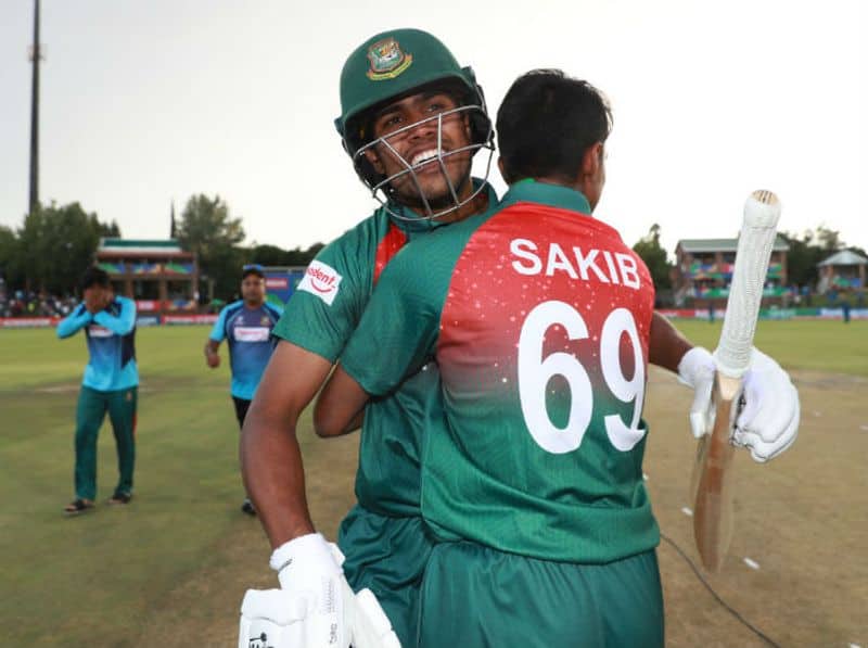 Mohammad Tanzim Hasan Sakib of Bangladesh congratulates Mohammad Akbar Ali of Bangladesh, after he hit the winning runs during the ICC U19 Cricket World Cup Super League Final match between India and Bangladesh at JB Marks Oval on February 09, 2020 in Potchefstroom, South Africa. (Photo by Matthew Lewis-ICCICC via Getty Images)