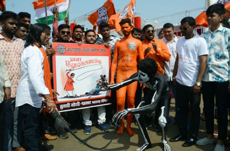 Maharashtra Navnirman Sena (MNS) workers participate in a march from Marine Drive to Azad Maidan, demanding eviction of illegal immigrants from Pakistan and Bangladesh staying in India, in Mumbai on Sunday. (ANI Photo)