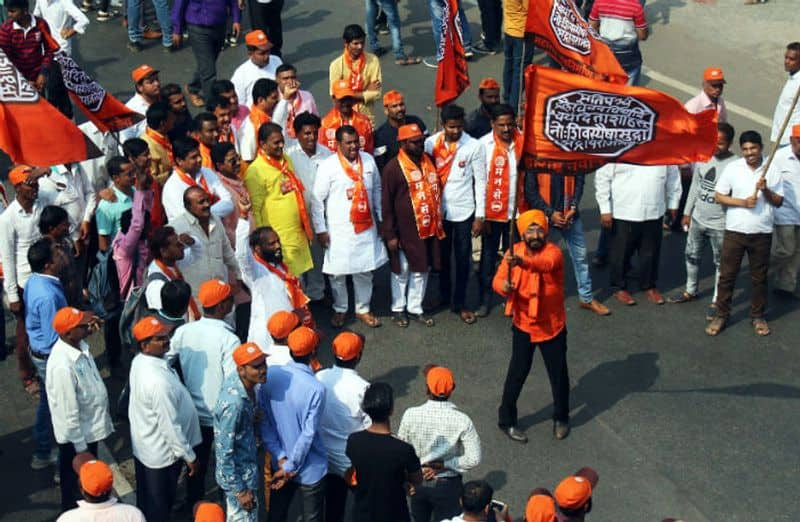 Maharashtra Navnirman Sena (MNS) workers during a rally from Marine Drive to Azad Maidan, demanding eviction of illegal immigrants from Pakistan and Bangladesh staying in India, in Mumbai on Sunday. (ANI Photo)