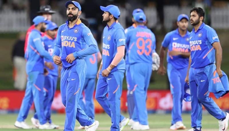 Virat Kohli and his teammates are disappointed as they leave the field after the end of the match