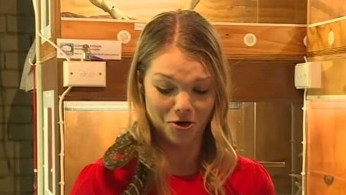 a snake sorrounds anchors neck while shooting the programme a snake sorrounds anchors neck while shooting the programme