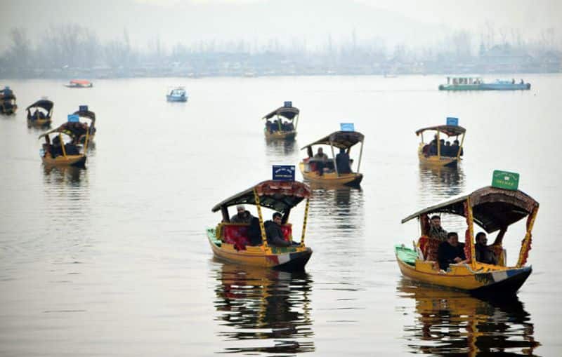 The 25 foreign envoys of the second batch take Shikara rides during their visit, at Dal Lake in Srinagar on Wednesday. (ANI Photo)