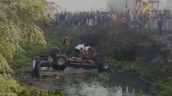 A Pool car falls into a canal after hitting a Lorry in Hooghly A Pool car falls into a canal after hitting a Lorry in Hooghly