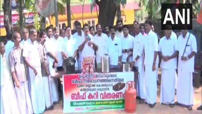 Congress distributes beef curry in front of police station in Kerala Congress distributes beef curry in front of police station in Kerala