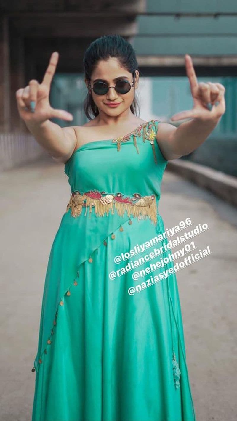 biggboss losliya recent sharing green color dress photo gallery