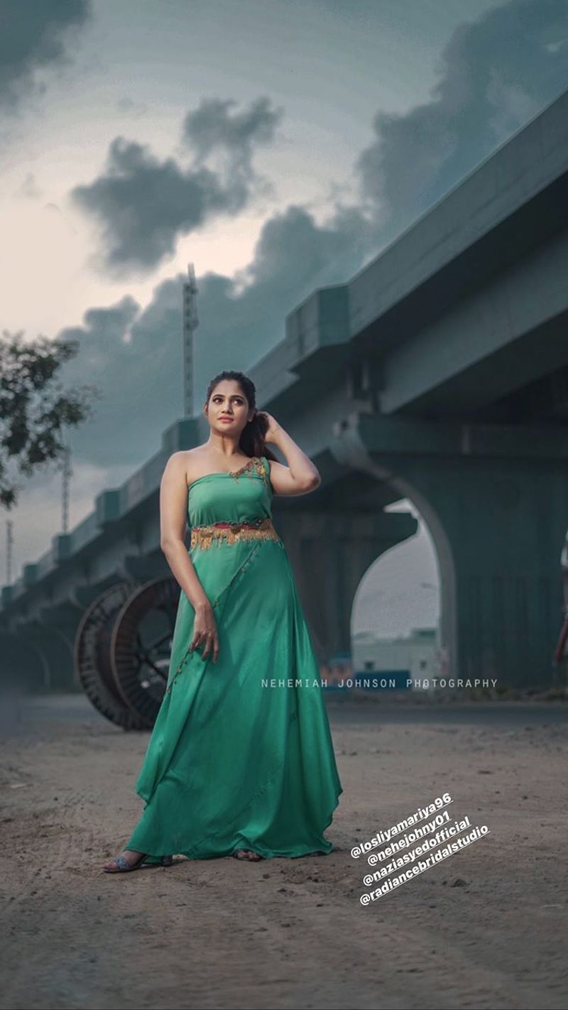 biggboss losliya recent sharing green color dress photo gallery