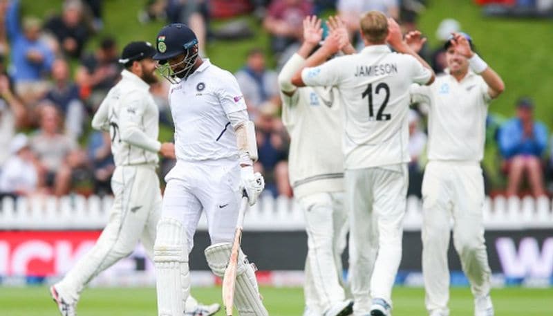 New Zealand players celebrate after getting the wicket of Cheteshwar Pujara