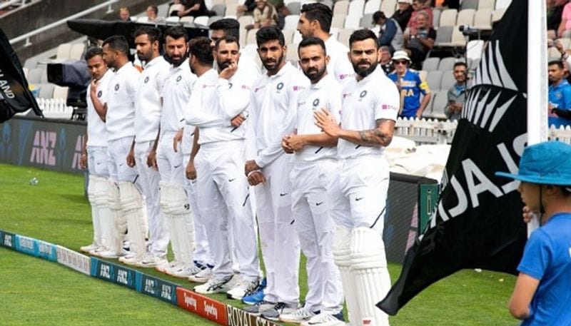 Indian players line up at the boundary before start of the play