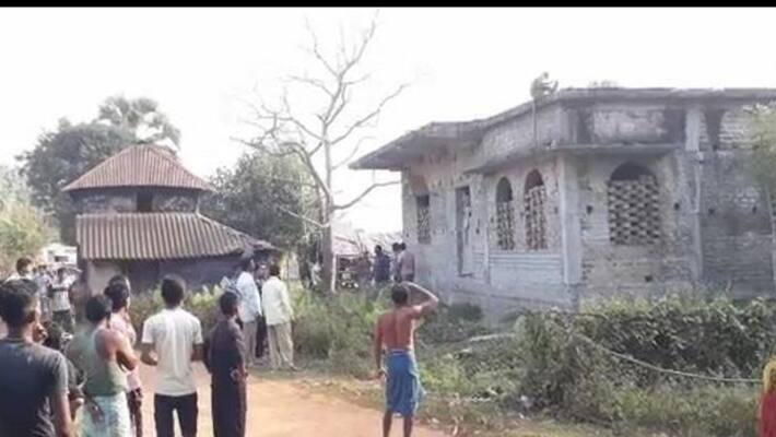 Forest workers struggle to catch an injured monkey in West Midnapore Forest workers struggle to catch an injured monkey in West Midnapore