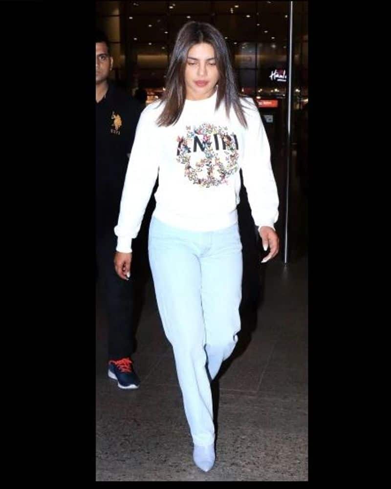 Priyanka Chopra pairs Rs 50k sweatshirt with jeans and boots at Mumbai airport