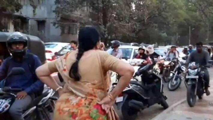 woman block bike riders who ride bike on foot path woman block bike riders who ride bike on foot path