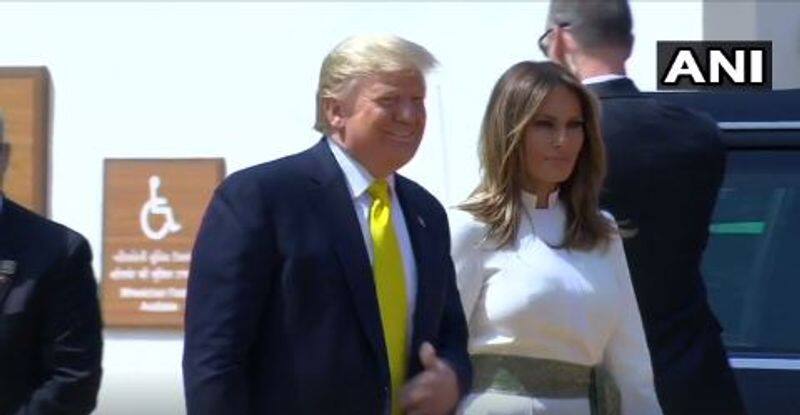 Donald Trump changes red tie to yellow before landing in Ahmedabad